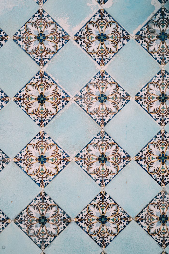 A detailed view of elegant blue and white geometric tiles creating a classic pattern.
